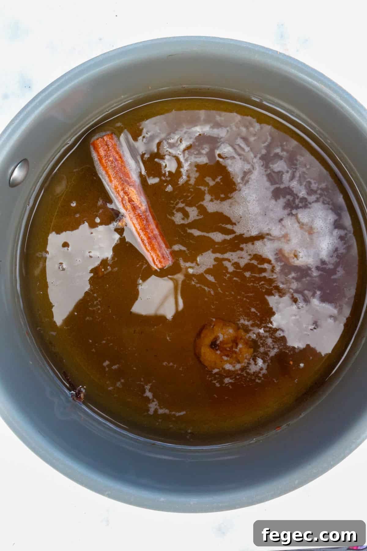 Authentic Mexican Café de Olla Recipe for Traditional Flavor 4 Small pot with water and simmering spices for cafe de olla