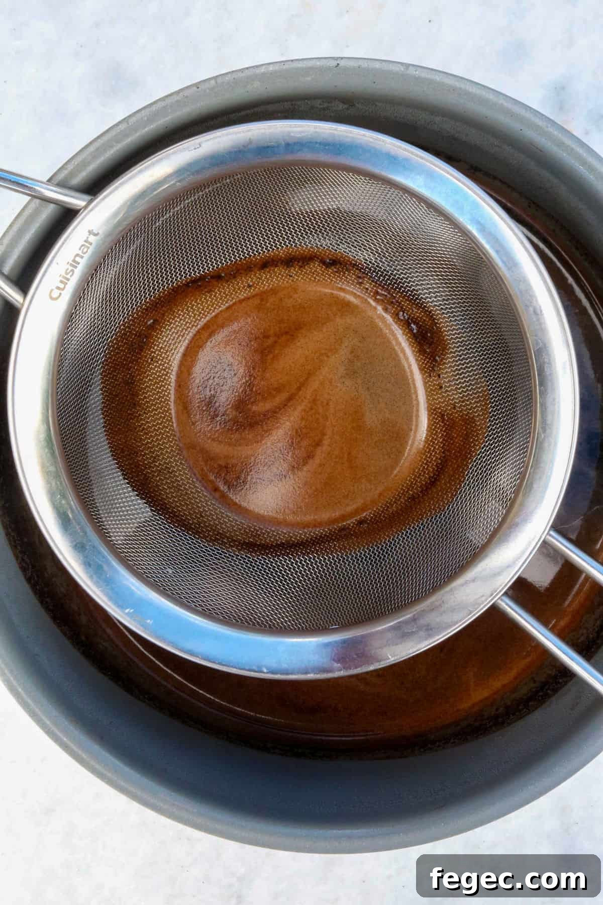 Authentic Mexican Café de Olla Recipe for Traditional Flavor 6 Mesh strainer in a pot to strain coffee