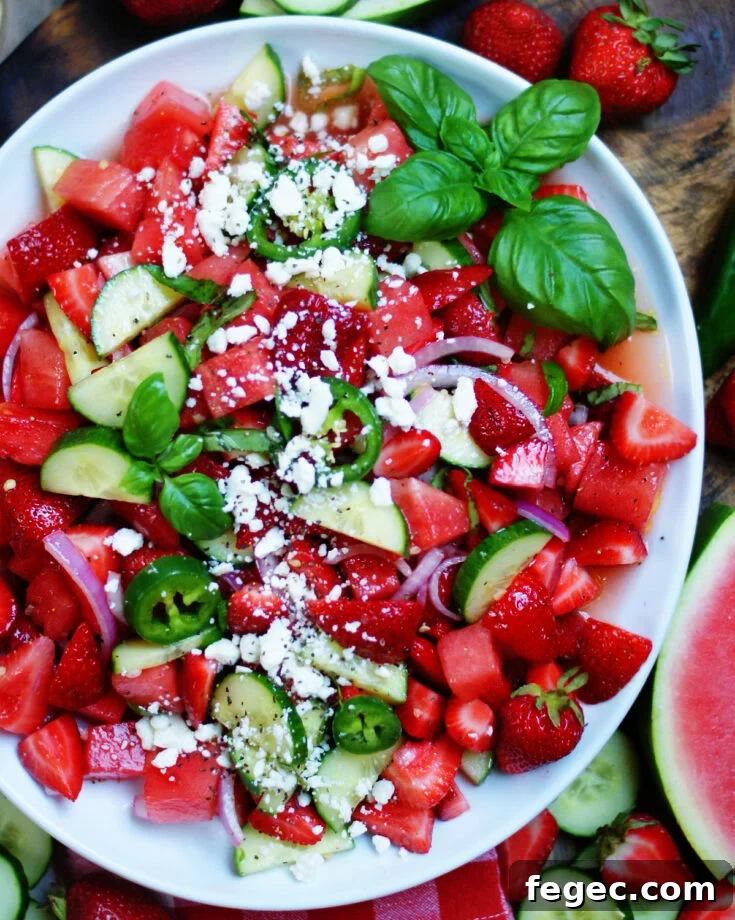 refreshing summer watermelon salad with cucumbers, feta, strawberries & jalapenos