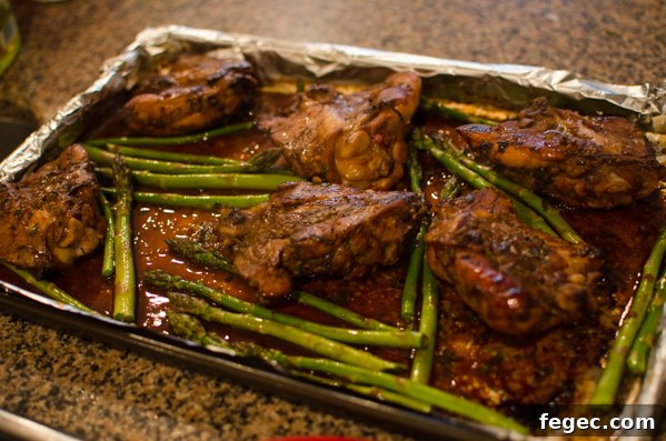 Soy Balsamic Chicken Thighs cooked with asparagus.