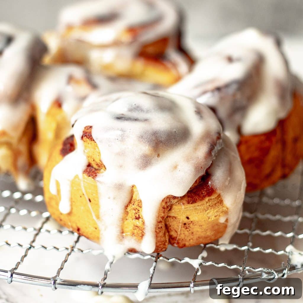 glazed cinnamon rolls on a wire rack