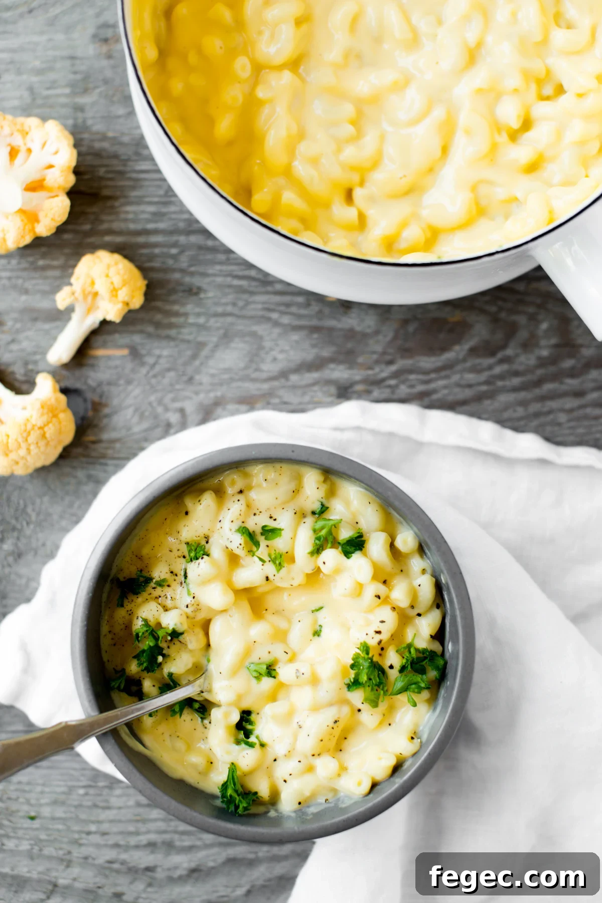 closeup of bowl of cauliflower mac and cheese with parsley