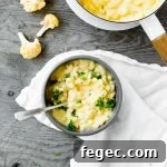 bowl of stovetop cauliflower mac and cheese with parsley garnish