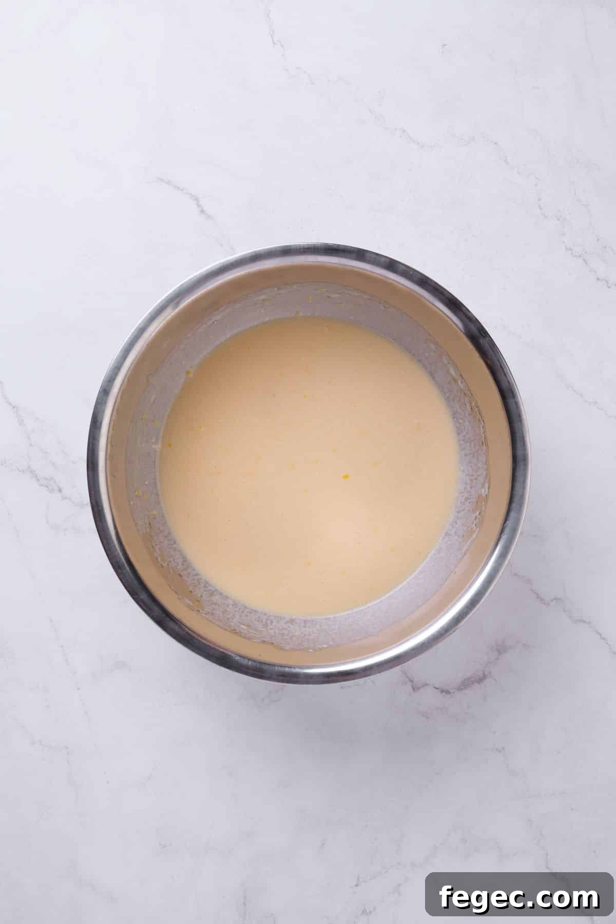 A bowl of lemon cake ingredients.