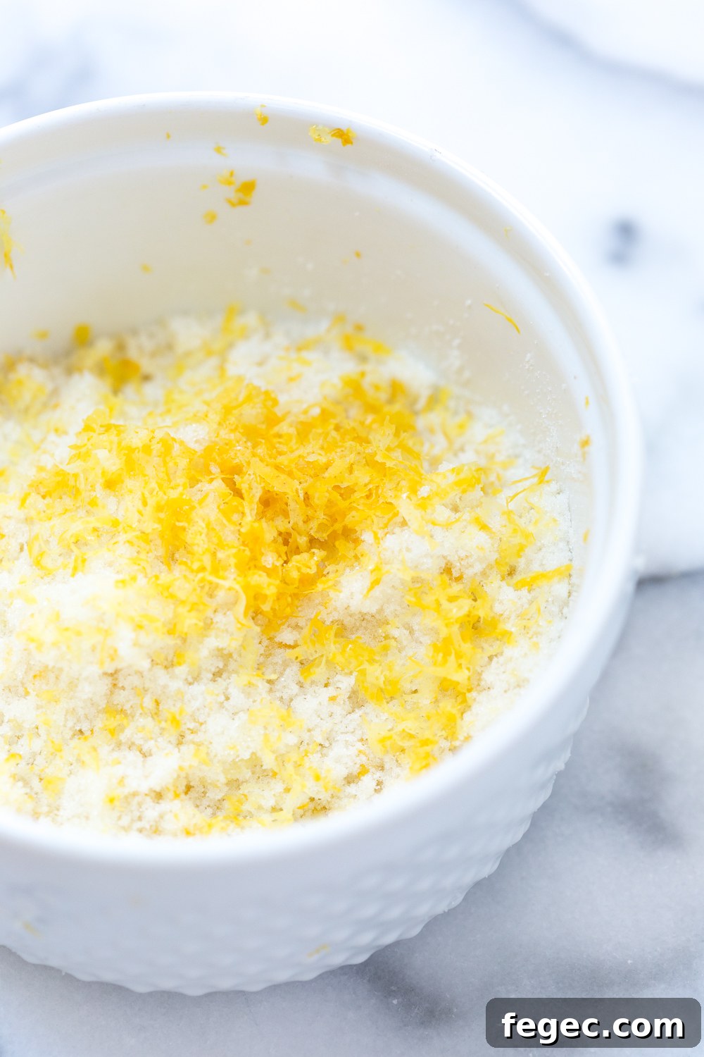 Mushing the lemon zest with the sugar gives the whole Raspberry Buttermilk Clafoutis a zesty sweetness.