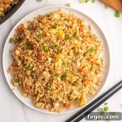 Chinese fried rice with chopsticks.