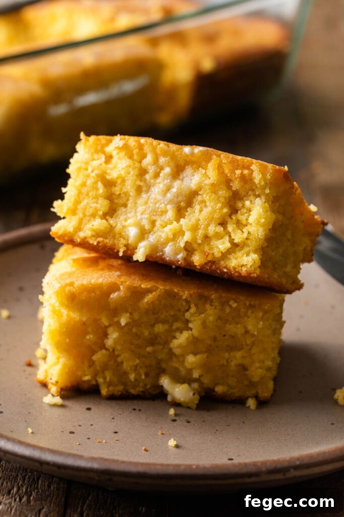 two slices of cornbread stacked up on a plate