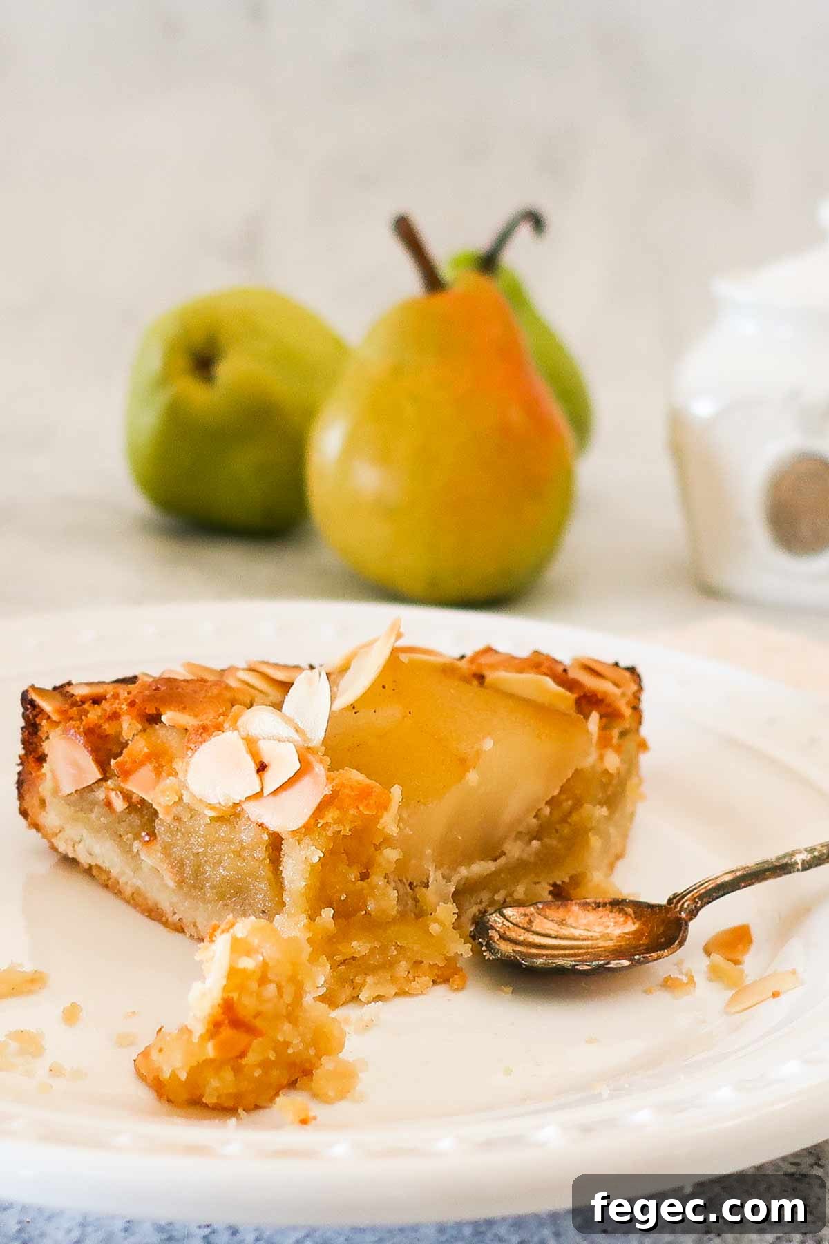 a slice of half eaten pear and almond dessert