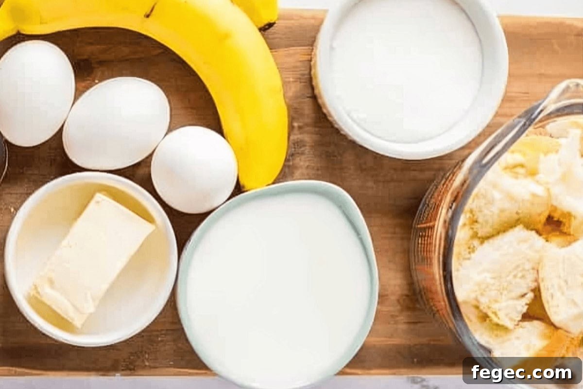 portioned ingredients for banana bread pudding in individual bowls on a cutting board.