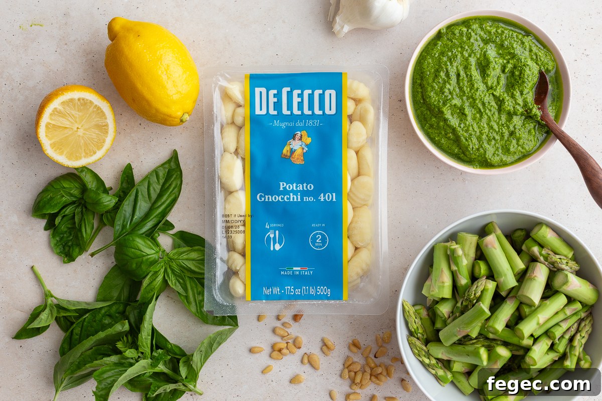 ingredients needed to make pesto gnocchi: storebought gnocchi, pesto, lemon juice, asparagus.