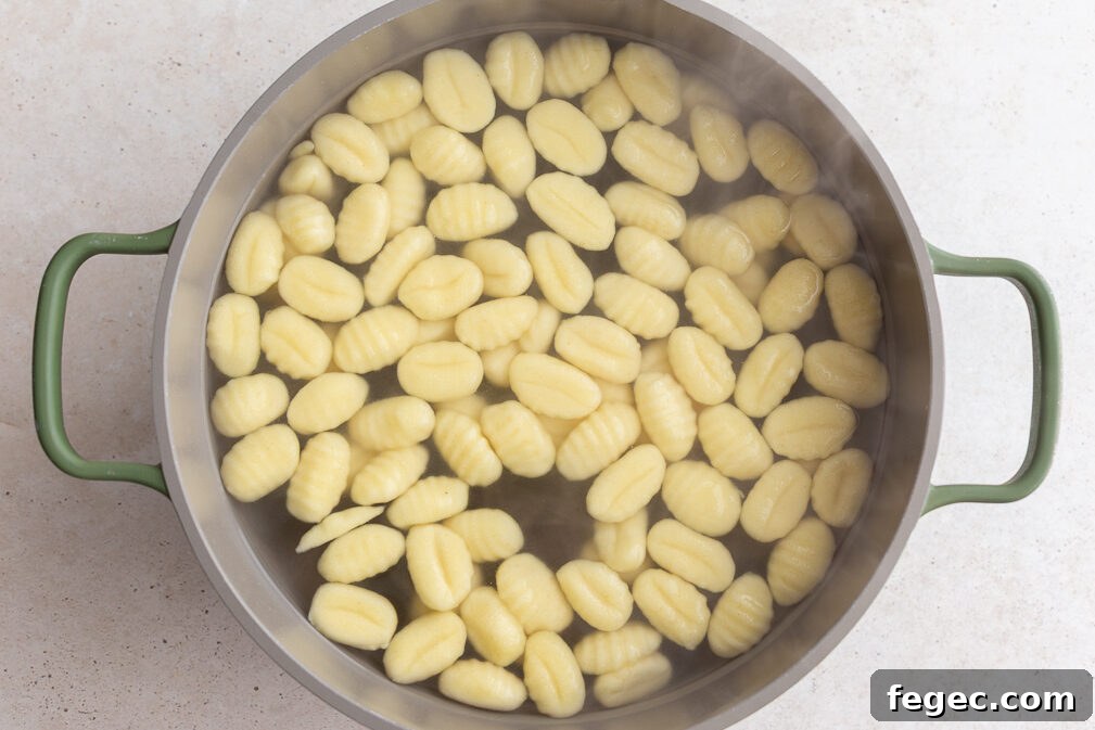 gnocchi cooking in a large pot
