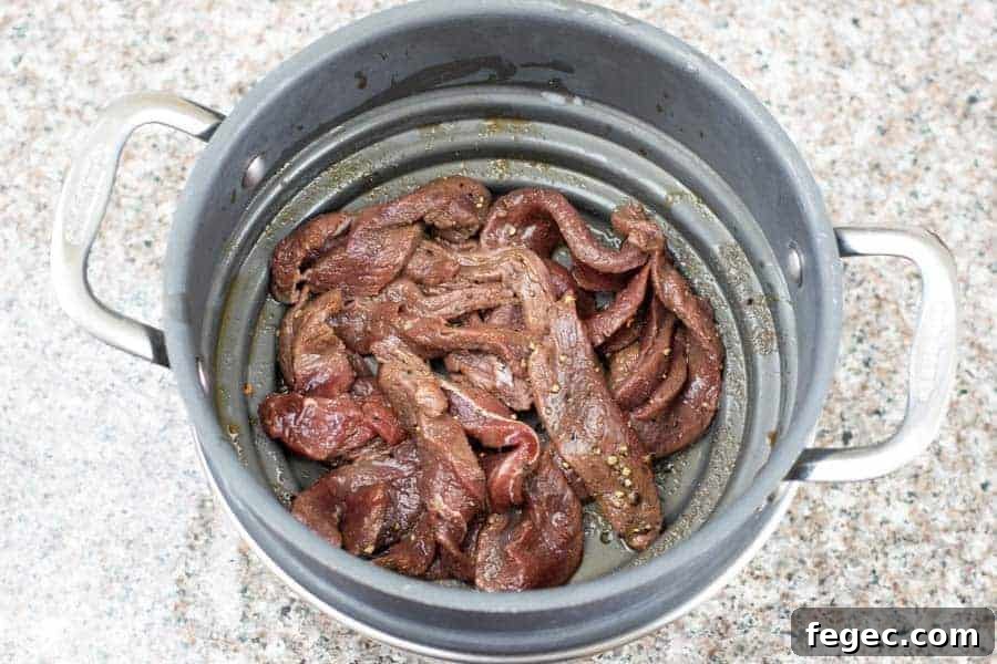 Corkscrew deer jerky strained in colander