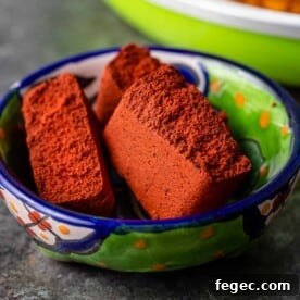 achiote paste broken into piece in small bowl