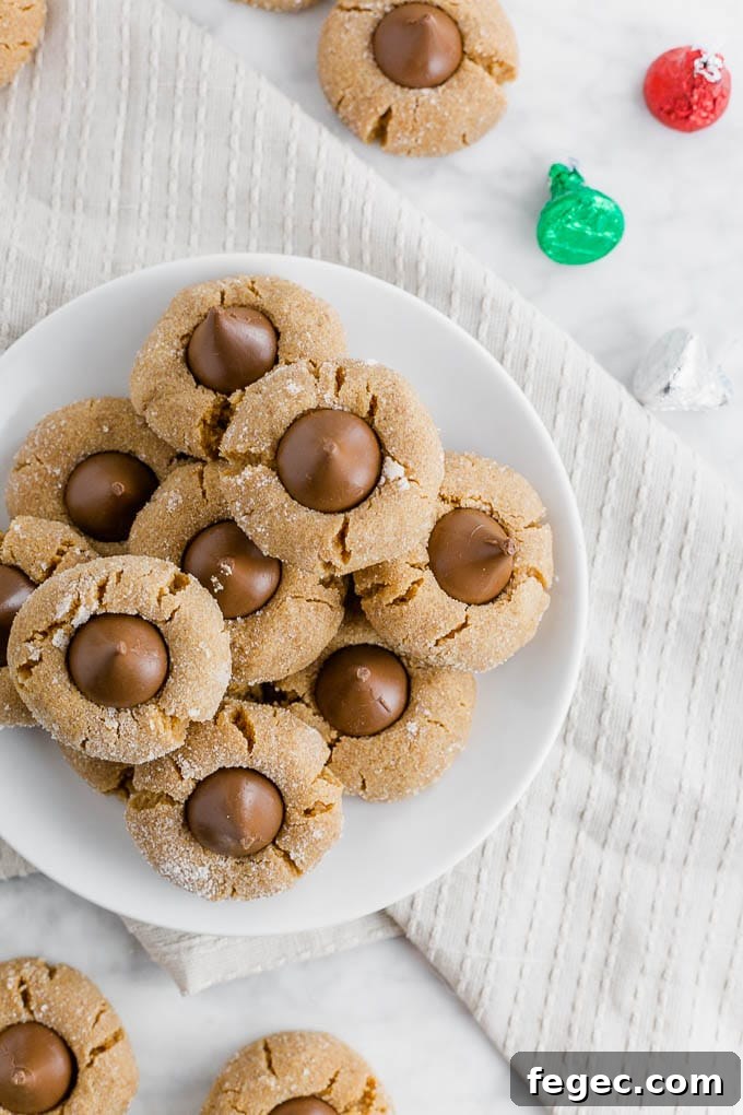 a plate of flourless peanut butter blossoms with chocolate kisses